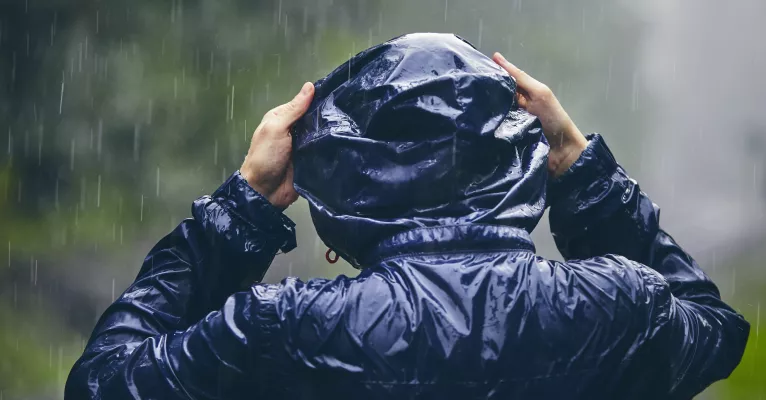 Person in water repellent coat