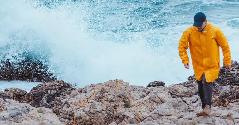 yellow raincoat sea